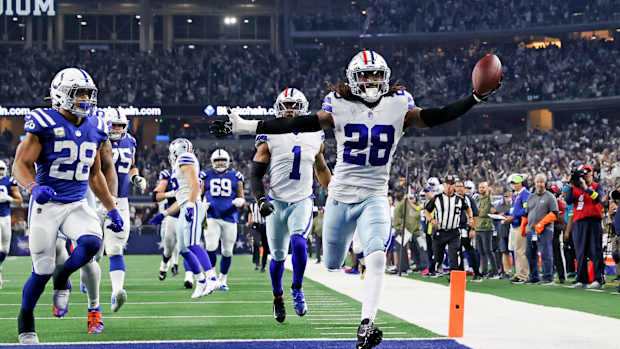 Dec 4, 2022; Arlington, Texas, USA; Dallas Cowboys safety Malik Hooker (28) recovers a fumble and runs it back for a touchdown during the fourth quarter against the Indianapolis Colts at AT&T Stadium.
